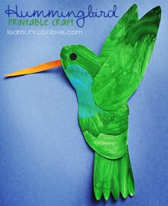 a green bird made out of paper on a blue background with the words, hummingbird printable craft