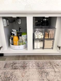 an area rug in the middle of a cabinet with various bathroom items and toiletries