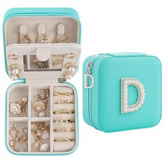 a blue case filled with lots of jewelry