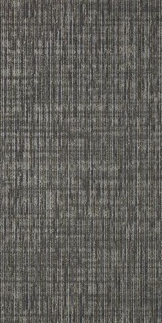 an up close shot of the texture of a carpet with grey and white stripes on it