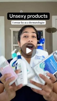 a woman is holding several bottles of toothpaste in front of her face with the caption unsex products i swear by as a dermatiollogist