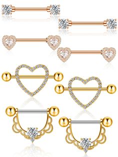 four different types of piercings with hearts and diamonds on them, all in gold