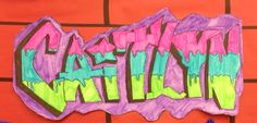 a child's drawing of the word graffiti on a wall