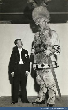 two men in costumes standing next to each other