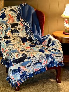 a chair with a blue and red blanket on it