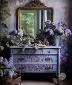 a dresser with flowers on it in front of a mirror