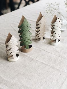 diy toilet paper christmas trees on a table