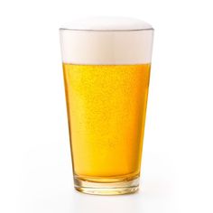 a glass filled with beer sitting on top of a table