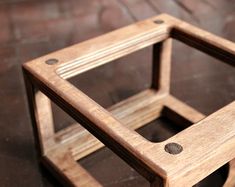 a small wooden object sitting on top of a table