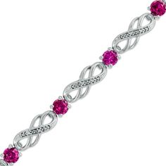 Express your affection with a colorful bracelet that says "I'll love you forever." Fashioned in sleek sterling silver, this bracelet features diamond-lined double infinity symbol-shaped links alternating with 4.5mm shimmering lab-created bright red rubies. A sweet and meaningful look she'll adore, this bracelet captivates with 1/20 ct. t.w. diamonds and a polished shine. The 7.5-inch style secures with a durable lobster claw clasp. Double Infinity, Silver Engraved Bracelet, Colorful Bracelet, Trending Bracelets, Peoples Jewellers, Mens Silver Necklace, Blue Topaz Stone, Blue Sapphire Diamond, Local Jewelry