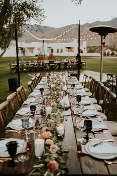 a long table set with plates and place settings