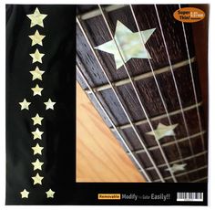 an acoustic book with gold stars on the cover, and black fabric to match it's guitar strings