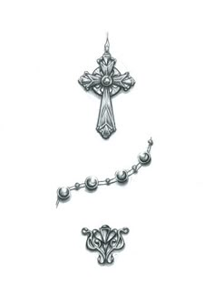 a cross and some pearls on a white background