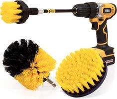 two yellow and black brush brushes on a white background, one is holding the other