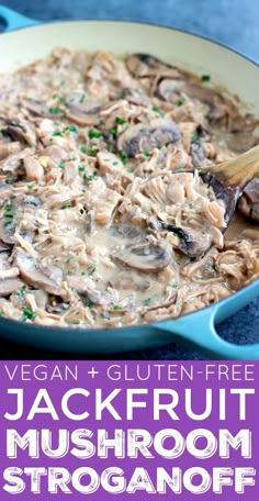 a blue pan filled with mushroom stroganonoff and topped with fresh parsley