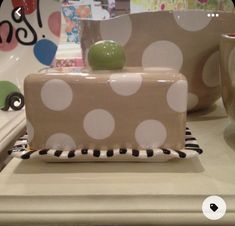 a polka dot cake sitting on top of a counter