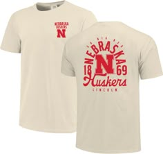 a white t - shirt with red lettering on the front and back, featuring an image of