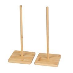 two wooden pegs are standing next to each other