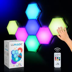 the remote control is next to an illuminated hexagonal object with colorful lights on it