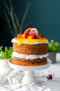 there is a cake with fruit on top