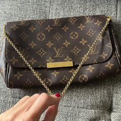 Louis Vuitton Favorite Mm. Authentic. This Bag Is In Excellent Condition. Date Code Sd 2163. Leather Is Beautiful Patina Color Comes W Dust Bag. Comes W Chain Strap And Also Original Leather Strap. This Bag Is Not Sold In Stores Any Longer. Classic And Beautiful. Inside Is Dark Maroon. One Tiny Imperfection/ Stain Shown In Pic. Louis Vuitton Favorite Mm, Favorite Mm, Louis Vuitton Favorite, Patina Color, Dark Maroon, Chain Strap, Louis Vuitton Bag, Leather Straps, Patina