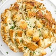 a white plate topped with bread and cheese