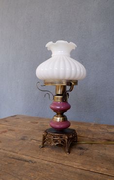 a lamp sitting on top of a wooden table