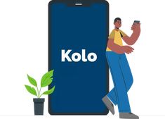 a man leaning against a giant cell phone with the word kolo on it