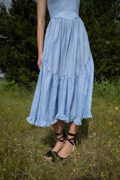 A truly special dress. With rich black ribbon tie straps, a corset bodice, and sweeping ruffle hem the Mirabelle Dress is dramatic, romantic beauty at its best and one of our most popular styles. Made in a lightweight blue gingham linen with a sateen finish that gives the linen a subtle dressy luster. A showstopper of a dress made for special moments, celebrations, or romantic getaways. Dorothy Aesthetic, Ruffled Gown, Princess Dresses