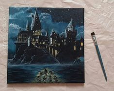 a painting of hogwart's castle is shown next to a brush