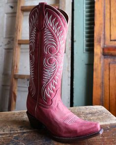 Looking for western fashion boots or a pair of riding boots? Well, you need not look any further. These Circle G By Corral Women's Distressed Red/White Embroidery Tall Top Boots will look great on you in the saddle or out on the town with jeans or a skirt. Upper material: Leather; Leather lining Red distressed finish Embroidered western textured detailing Walking heel; 2 inch cowboy heel M Width is an average width for women Snip toe Red Western Heeled Boots With Round Toe, Luxury Red Round Toe Cowboy Boots, Red Western Boots With Round Toe, Red Western Mid-calf Boots For Winter, Western Style Red Leather Mid-calf Boots, Combat Boots Heels, Knit Swimwear, Straw Cowboy Hat, Felt Cowboy Hats