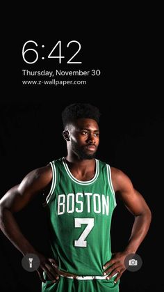 a man in a boston basketball uniform is standing with his hands on his hips and looking at the camera