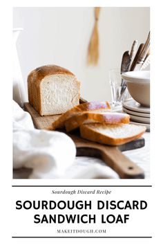 a loaf of bread sitting on top of a cutting board