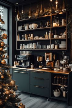 a christmas tree in the corner of a room with many dishes and cups on it