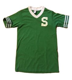 a green soccer jersey with white stripes and the number s on it's chest