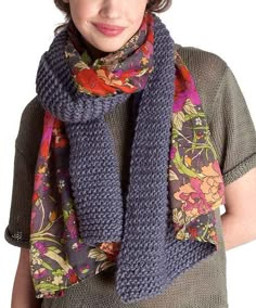 a woman wearing a scarf with flowers on it