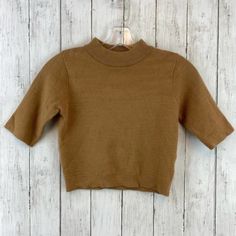 Princess Polly Brown Mock Neck Short Sleeve Cropped Sweater Size S/M 48% Viscose, 28% Polyester, 24% Spandex Pullover Mock Neck Short Sleeves Cropped Length Machine Wash Offers Accepted Bundle For Bigger Discounts ! Brown Stretch Tops For Fall, Beige Top With Ribbed Collar For Fall, Khaki Knit Tops For Fall, Brown Crew Neck Top For Fall, Casual Camel Top For Fall, Brown Crew Neck Top For Winter, Beige Turtleneck Top For Work, Brown Knit Tops For Work, Brown Sweater With Ribbed Collar For Spring