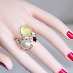 Lemon Quartz, Pearl, Garnet & Amethyst Sterling Silver Gold Vermeil Ring. This Size 8.5 Wrap-Around Satin Finish Sterling Silver Artistic Ring Has A ½” Bezel Set Lemon Quartz Cabochon And A ½” Mabe Pearl. The Gold Leaf On The Pearl Has 2 Garnets. The Flower-Like Setting Has A .5 Carat Oval Rhodolite Garnet & 2 Amethyst. Ring Is Unique- Twig Like Band, Leaf Detailing, 14 Kt Gold Vermeil Highlights. Looks Gorgeous On Any Finger Or Thumb. Weight 12 Grams. Ring Is Adjustable. Stamped 925. Mabe Pearl, Rhodolite Garnet, Lemon Quartz, The Pearl, Amethyst Ring, Womens Jewelry Rings, Gold Leaf, Satin Finish, Gold Vermeil