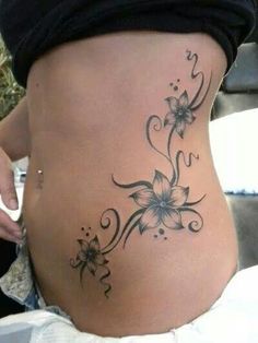 a woman's stomach with flowers on it