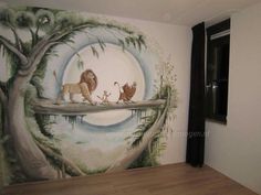 the lion king mural is painted on the wall in this children's playroom