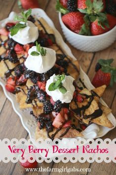 very berry dessert nachos with chocolate sauce and strawberries on the side,