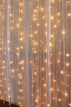 the curtain is covered with lights and beads