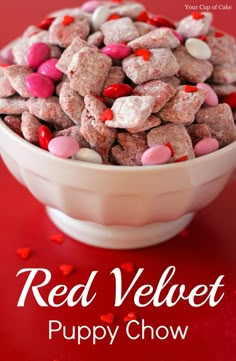 red velvet puppy chow in a white bowl on a red background with the words, your cup of cake