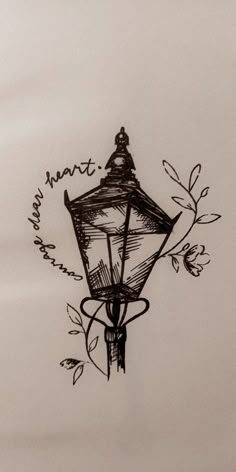 a black and white drawing of a street light with the words heart on it's side