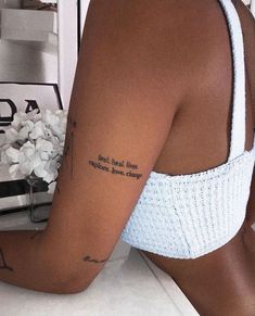 the back of a woman's arm with a tattoo saying, for real love everyone loves caring