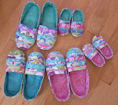 several pairs of slippers are laid out on the floor