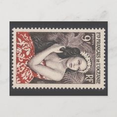 a stamp with an image of a woman in red and white on the bottom half of it