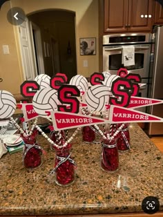 volleyball themed centerpieces on top of a kitchen counter