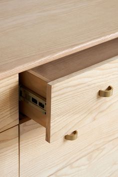 a close up of a wooden dresser drawer