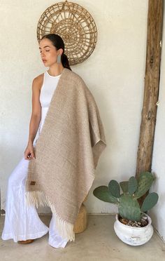 ☝ 100% Llama Wool  ✂ Dimensions: 25.5" x 70.8" inches  ▓ Unisex Argentine Shawl ✔ Due to being handmade products, there may be slight variations in colors, designs, and measurements between one product and another.    ★ Discover the essence of the Patagonian Andes at Pampa Root, where tradition meets timeless elegance. Our high-quality ponchos and ruanas are meticulously handwoven with noble fibers sourced from the heart of the Andes, using time-honored traditional looms.  ☀ Ancient weaving techniques breathe life into each unique piece, transcending fashion to embody luxury and sustainability. We proudly uphold the cultural heritage of Andean communities, ensuring a triple impact - social, environmental, and economic.  ☝ Our commitment to sustainability extends to using natural dyes, capt Argentinian Fashion, Luxury Handmade Shawl As A Gift, Sustainable Luxury Fashion, Handmade Alpaca Shawl For Winter, Traditional Alpaca Poncho For Fall, Winter Alpaca Shawl, Traditional Alpaca Winter Cape, Traditional Alpaca Shawl Cape, Alpaca Clothing